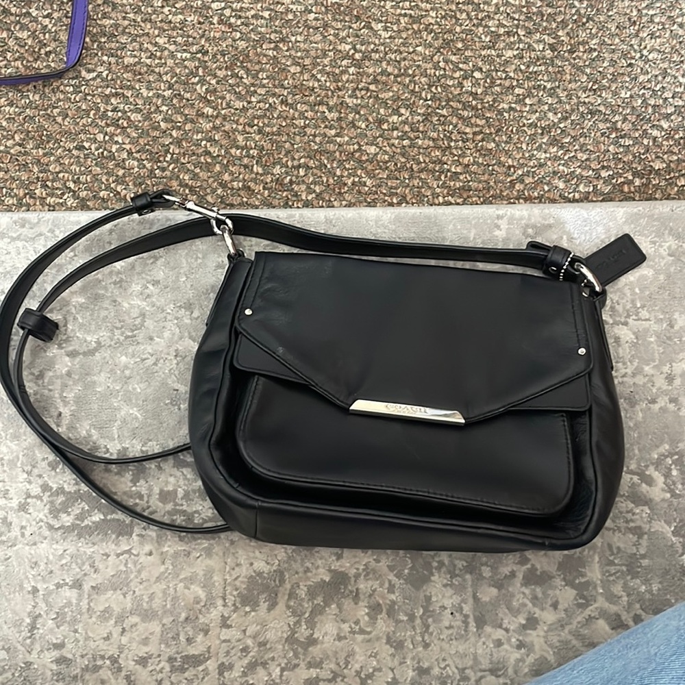 Black leather Coach over the shoulder hand bag